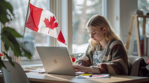 Smiling international student in Canada with books and a Canadian flag in the background, representing new Canada visa policy 2025 and opportunities after graduation.